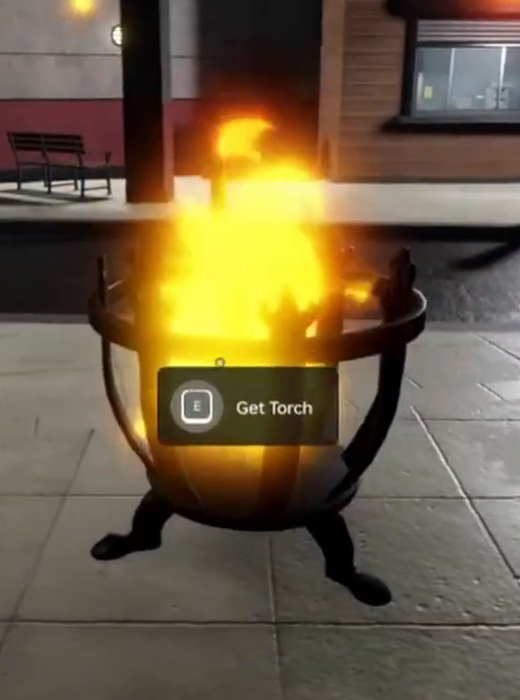 Use the Get Torch prompt at the burning brazier in the shawarma room.